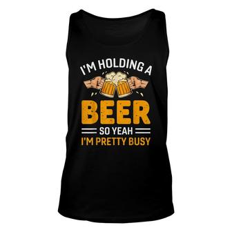 Funny Im Holding A Beer So Yeah Im Pretty Busy Drinking Unisex Tank Top - Thegiftio