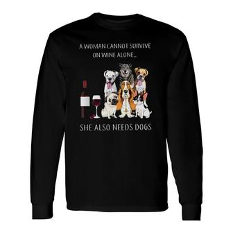 A Woman Cannot Survive On Wine Alone She Also Needs Dogs Long Sleeve T-Shirt - Seseable