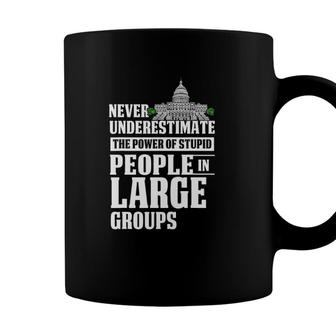 Never Underestimate Power Of Stupid People In Large Groups Coffee Mug - Seseable