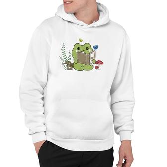 Womens Cute Frog Reading A Book On Mushroom Cottagecore Aesthetic V-Neck Hoodie | Mazezy