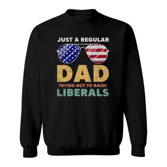 Just A Regular Dad Trying Not To Raise Liberals American Flag Sunglasses Republican Fathers Day Sweatshirt - Seseable