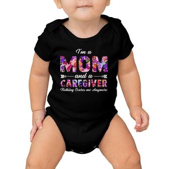Rn Nurse Im A Mom And A Caregiver Nothing Scares Me Baby Onesie | Mazezy