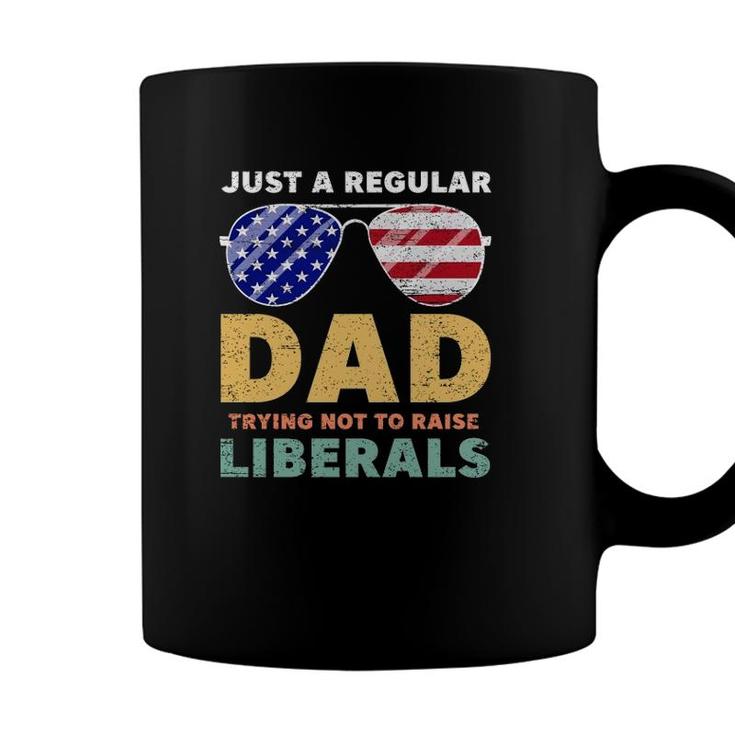Just A Regular Dad Trying Not To Raise Liberals American Flag Sunglasses Republican Fathers Day Coffee Mug