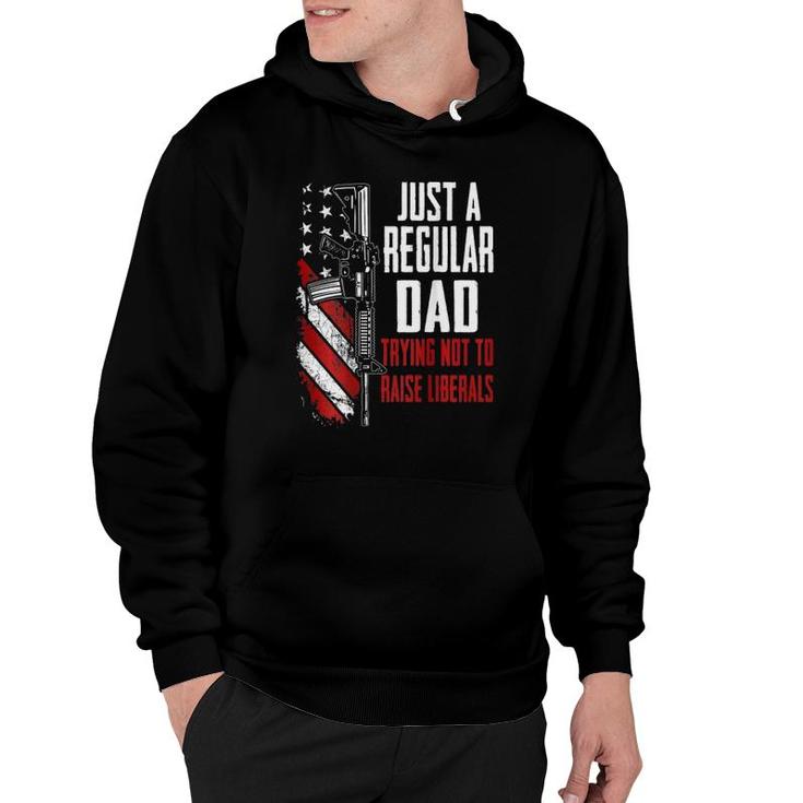 Just A Regular Dad Trying Not To Raise Liberals -- On Back Hoodie