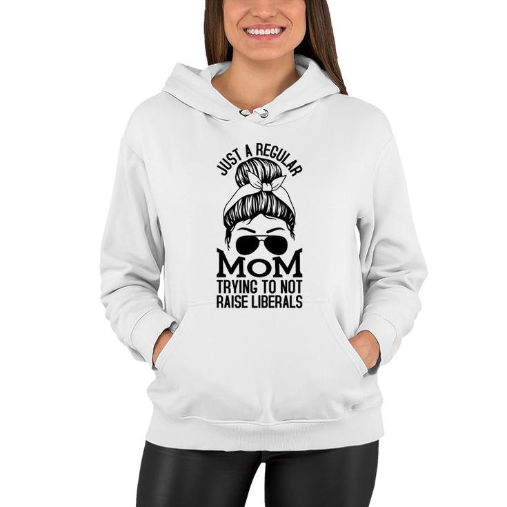 Just A Regular Mom Trying To Not Raise Liberals Black Graphic Women Hoodie
