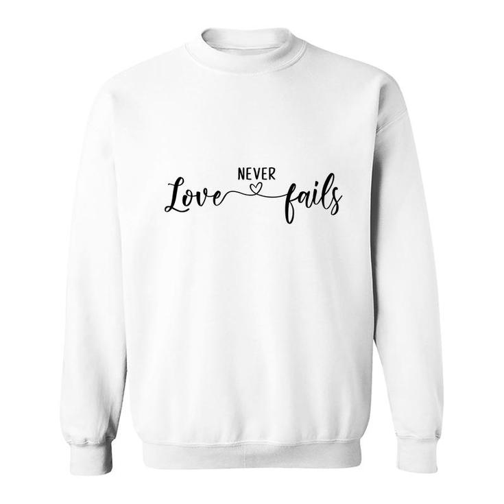 Bible Verse Black Graphic Love Never Fails Christian Sweatshirt